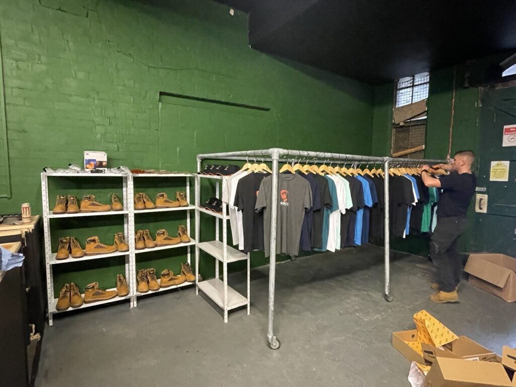 Final touches are added in place before the pre-opening - including assembling the clothing rack and placing all the safety equipment.